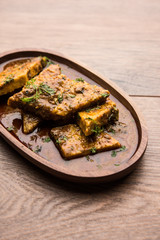 Patodi Rassa Bhaji or patwadi Sabji, a popular Maharashtrian spicy recipe served with Chapati and salad. Selective focus