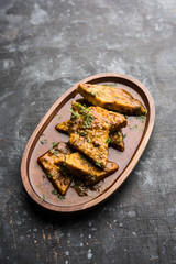 Patodi Rassa Bhaji or patwadi Sabji, a popular Maharashtrian spicy recipe served with Chapati and salad. Selective focus