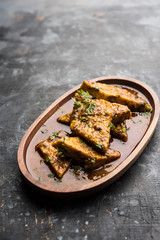 Patodi Rassa Bhaji or patwadi Sabji, a popular Maharashtrian spicy recipe served with Chapati and salad. Selective focus