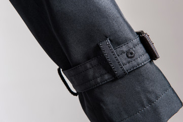 Partial close-up of cuffs in dark coat