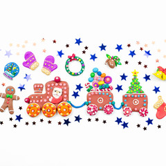 Merry Christmas greeting card with decorations. Santa, Christmas train with tree and sweets, snowman, reindeer and gifts