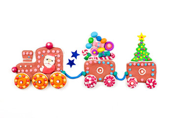 Obraz na płótnie Canvas Merry Christmas greeting card with decorations. Santa, Christmas train with tree, sweets and gifts