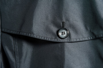 Partial close-up of buttons in dark clothes