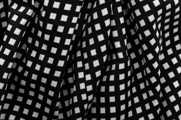 Fragment of black and white fabric. Plaid cotton fabric background