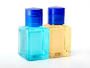 Shampoo and shower gel on a white background. Hotel cosmetic bottles isolated on white. Mini bottle set