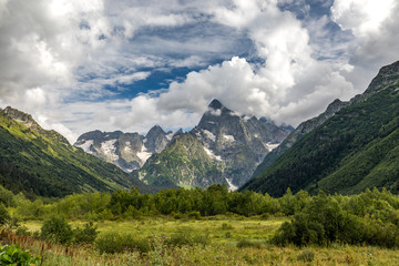 Fototapeta na wymiar The view of the mountains of Dombai. The Caucasus - Russia