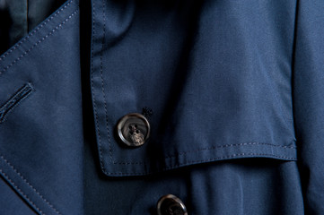 Partial close-up of buttons in dark clothes