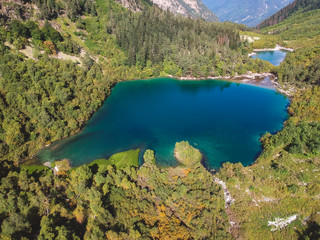 Fototapeta na wymiar Baduk lakes from the height of the quadrocopter in summer, Alpine lakes among the mountains with forest