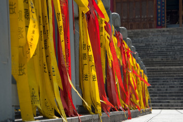 Red and yellow Prayer flags by temple steps