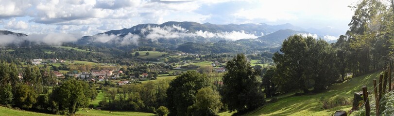 Fototapeta na wymiar Panoramic of the Basque countryside with the fog in the valleys