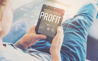 Profit with man using a tablet in a chair