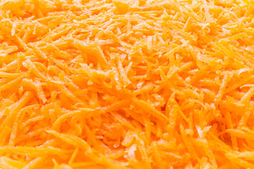 Carrots grated finely fresh orange. Close up.
