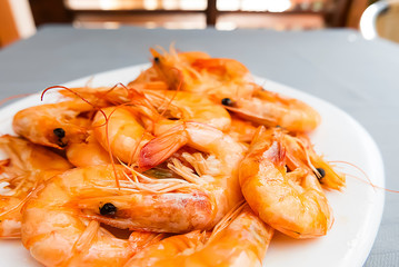 Boiled shrimps on a white plate.