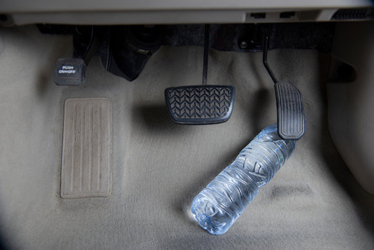 Content should not be placed on water bottles or other objects. Placed next to the throttle or brake pedal as it could be dangerous