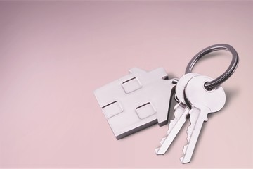 House shaped keychain and keys isolated on white background