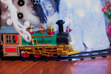 Green toy train on rails