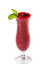 Glass of red currant berries fresh shake decorated with mint and blueberry isolated at white background.