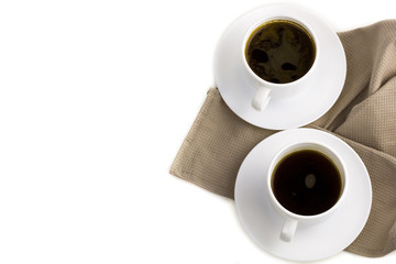 coffee cup on cloth napkin isolated on white background