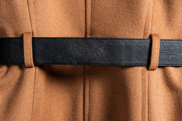 Coat black belt detail close-up