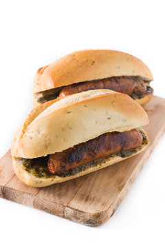 Choripan. Traditional Argentina sandwich with chorizo and chimichurri sauce. isolated on white background