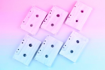top view audio cassete tapes pattern  pastel blue and pink gradient toned flat lay