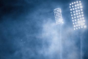 stadium lights and smoke