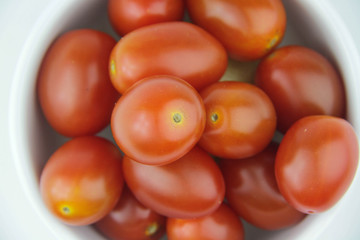 Cherry tomatoes on white background