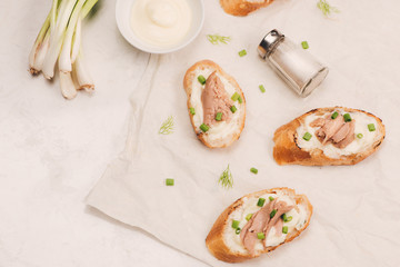 Italian cuisine. Bruschetta with tuna, onion, and mayonnaise.