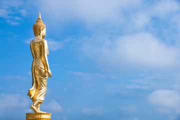 Golden Buddha statue standing at Wat Phra That Khao Noi, Nan Province, Thailand