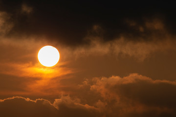sun with clouds in evening time