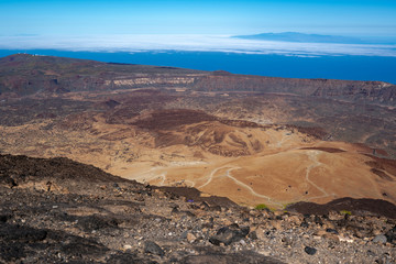 Fototapeta na wymiar Hikers overlook the volcano's crater at Altavista Refuge, near the summit of Mount Teide