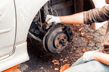 Closeup of work on fastening the car shock absorber.