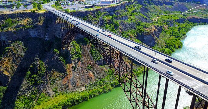 Perrine Bridge, Twin Falls, Idaho, USA - Aerial View Over River Canyon With Cars Driving On Road