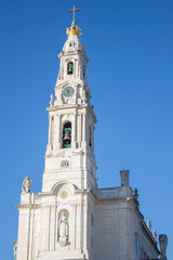 Fototapeta na wymiar The Sanctuary of Fatima (Basilica of Our Lady of Fatima) with blue sky, Portugal