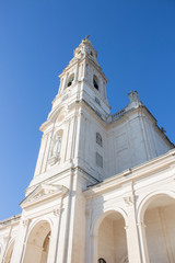 Fototapeta na wymiar The Sanctuary of Fatima (Basilica of Our Lady of Fatima) with blue sky, Portugal