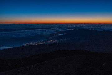 Fototapeta na wymiar Sun is rising over Canary Islands, seen from near the summit of Teide Mountain, Tenerife, Canary Islands, Spain