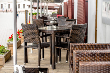 Tables in a cafe on the street of the ancient city 