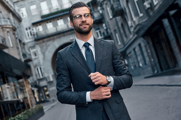 Confident and handsome. Full length of young man in full suit sm