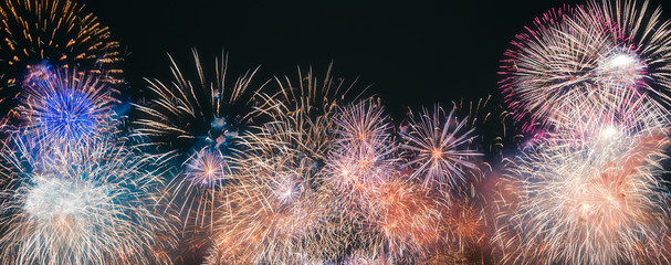 Colorful fireworks explosion on the black background