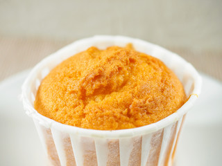 Vanilla muffins, paper cupcake holder, selective focus. Close-up photo of decorated homemade cupcakes in box. Gluten free almond flour muffin.