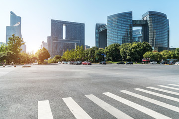 Fototapeta premium Empty road floor surface with modern city landmark buildings of hangzhou bund Skyline，zhejiang,china