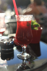 red cocktail on the table