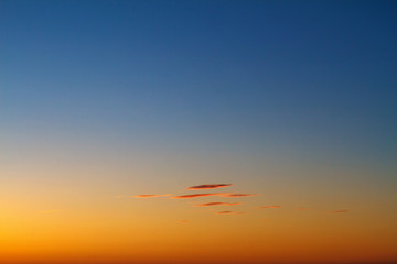 beautiful sunset clouds in the sky over the sea, bright colors of sunset