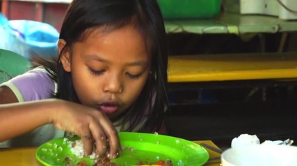  poor girl eat with bare hands of pauper's meal