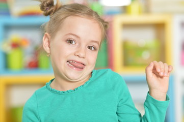 Portrait of little girl making funny faces