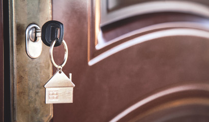  Key in keyhole with metal house.