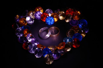 silver and gold ring, a heart-shaped colored crystals