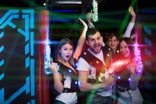 Friends with laser guns in colored beams