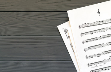 music notes on wooden table