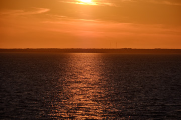 red saturated colors in sunset over the sea